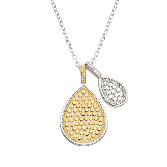 Gold and silver teardrop pendants on a white background