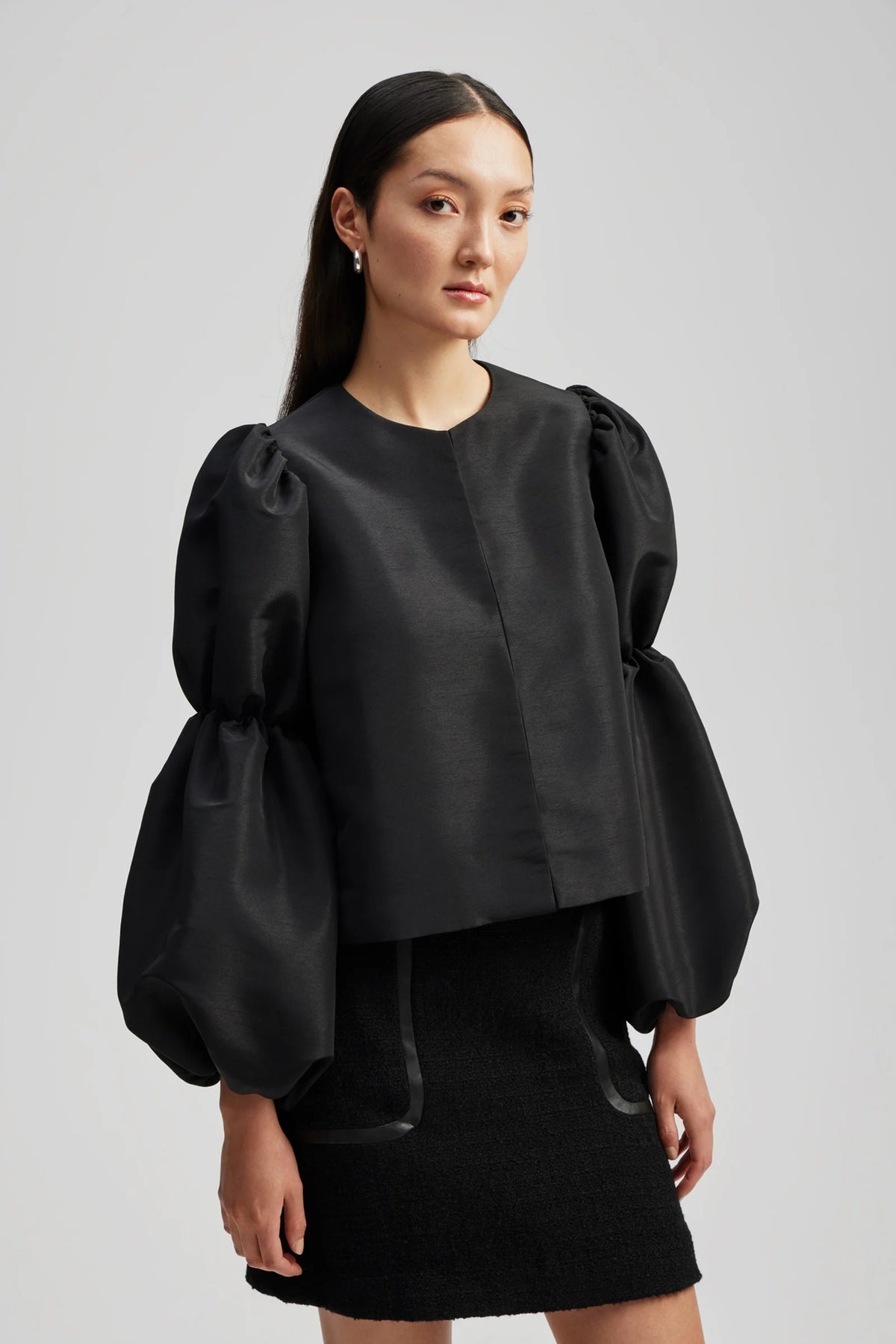 Black collarless shirt with puff sleeves and elasticated details