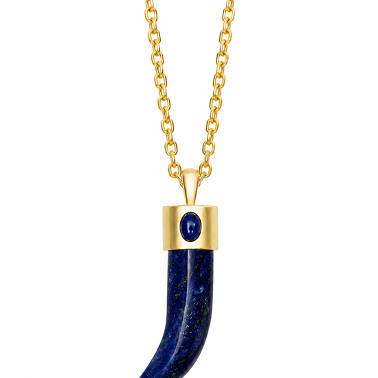 A gold chain necklace featuring a curved lapis lazuli pendant with a gold cap and a small round blue gemstone accent.