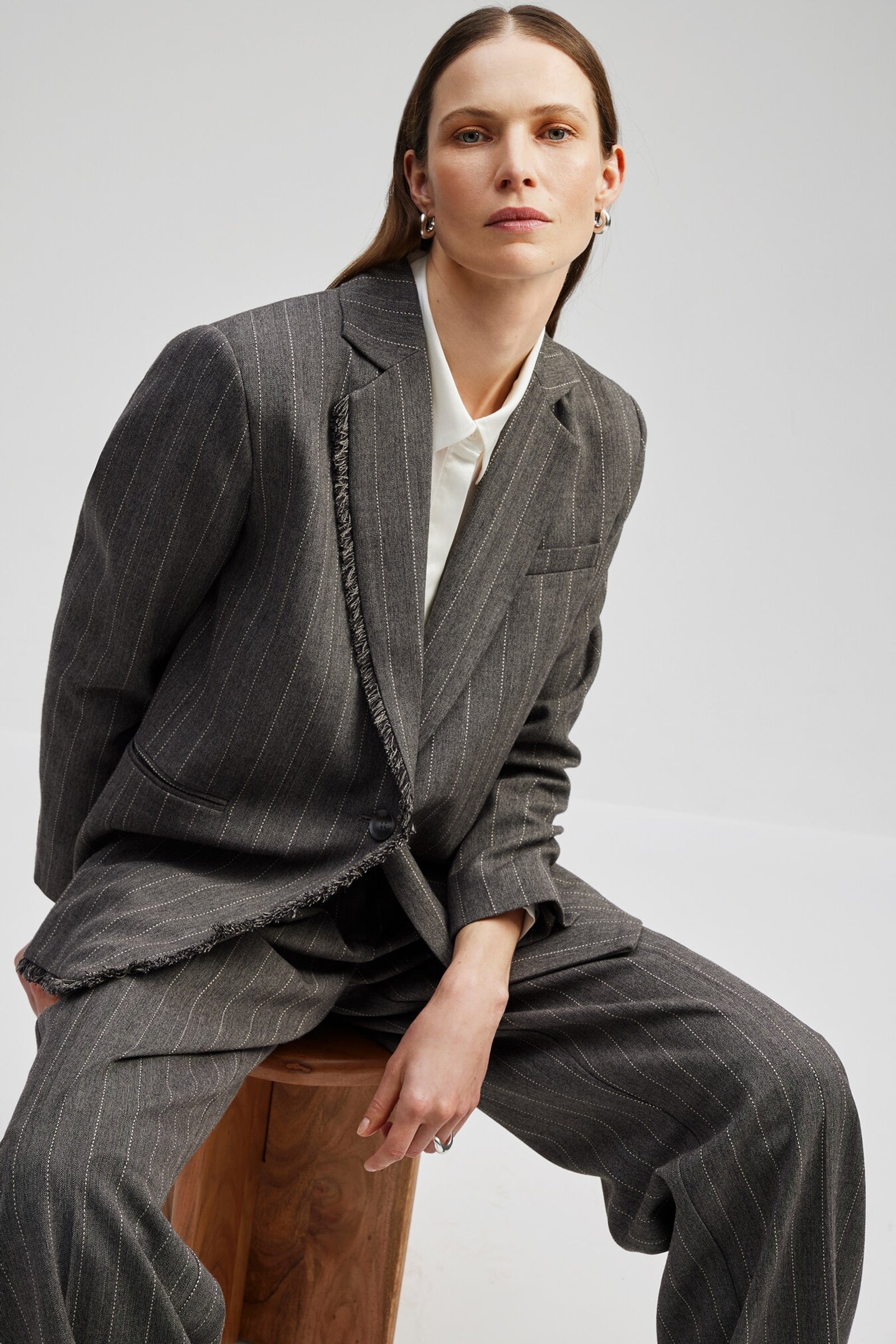 Grey single breasted pinstripe blazer with fringe detail