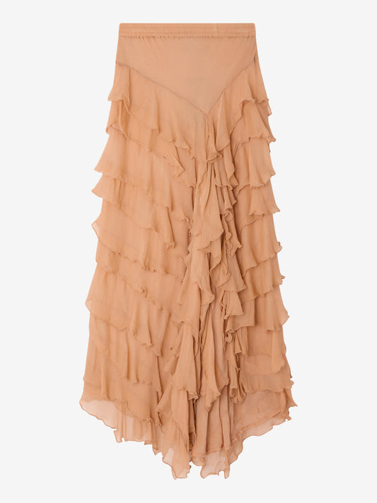 Tiered ruffle skirt in a shade of peach on a light gray background