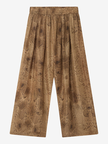 snake print wide leg trousers on a white background 