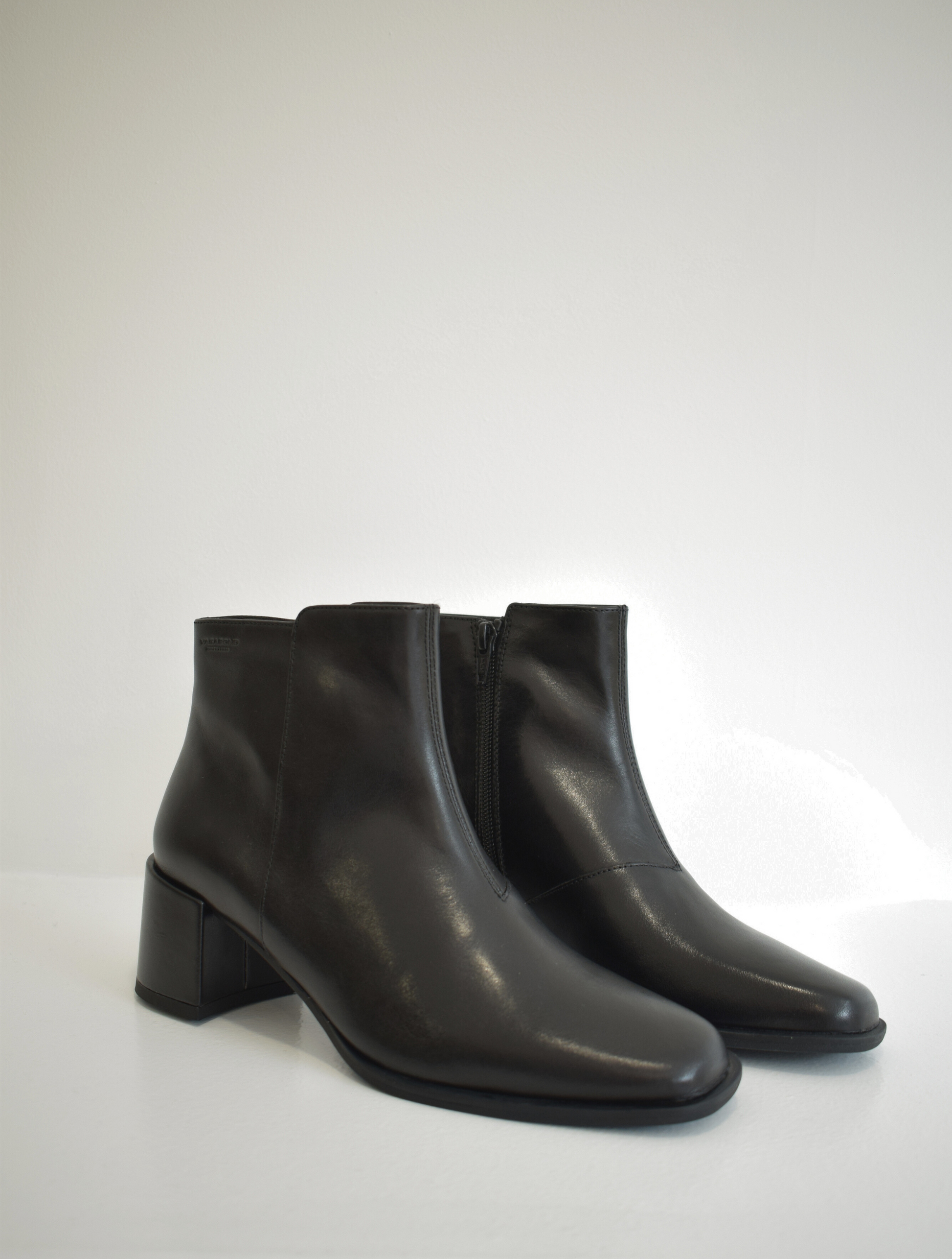 Black ankle boot with leather wrapped block heel and zip fastening