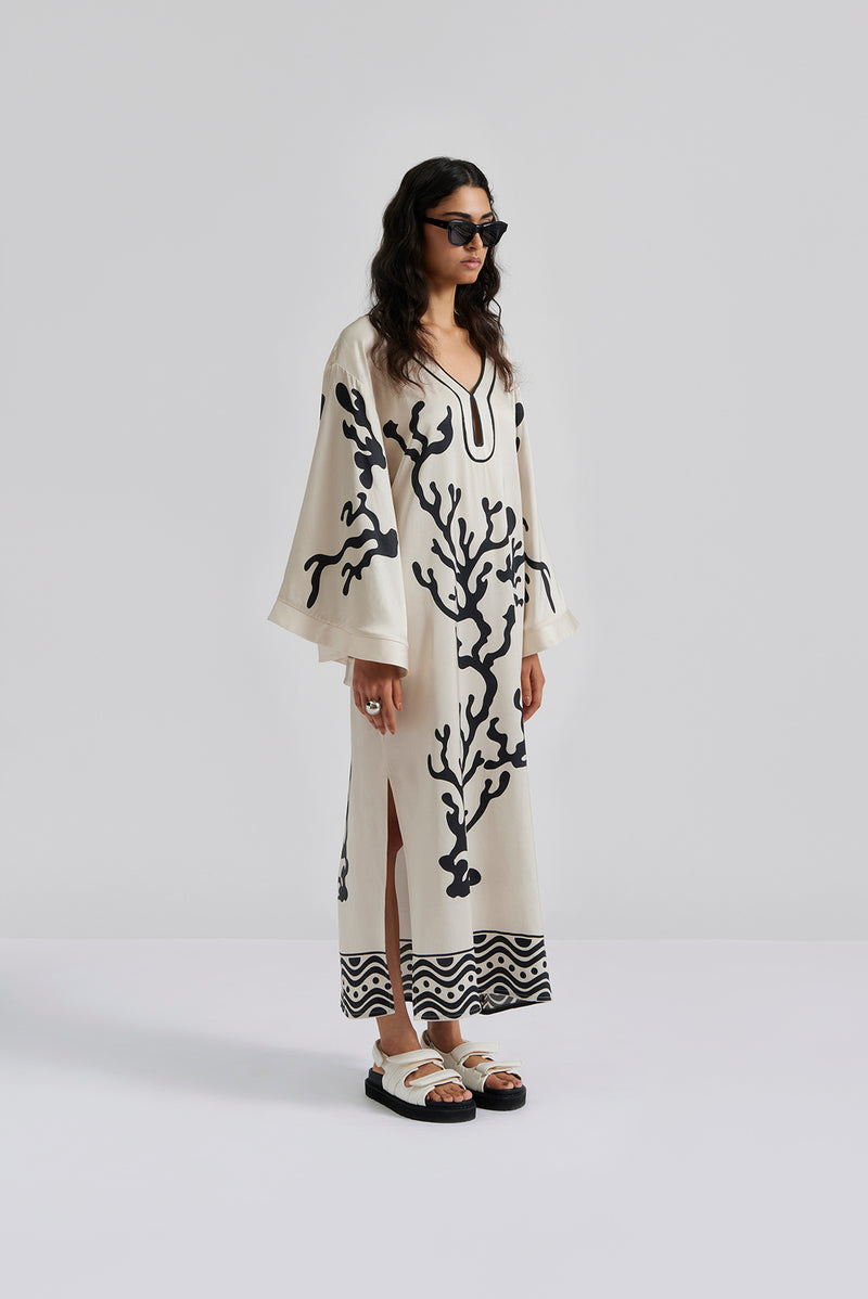 Ivory kaftan with side splits and wide fluted sleeves with black coral design