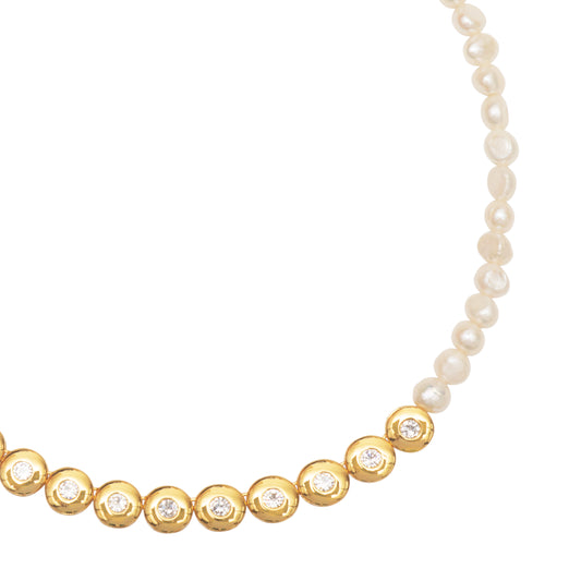 close up detail of gold plated necklace with fresh water pearl details