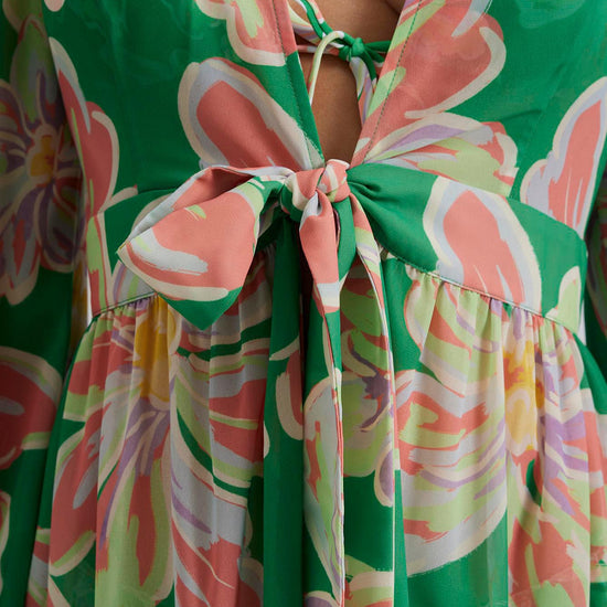 Green and soft pastel floral printed beach cover-up wiht long sleeves tie waist and ruffle details with V neckline