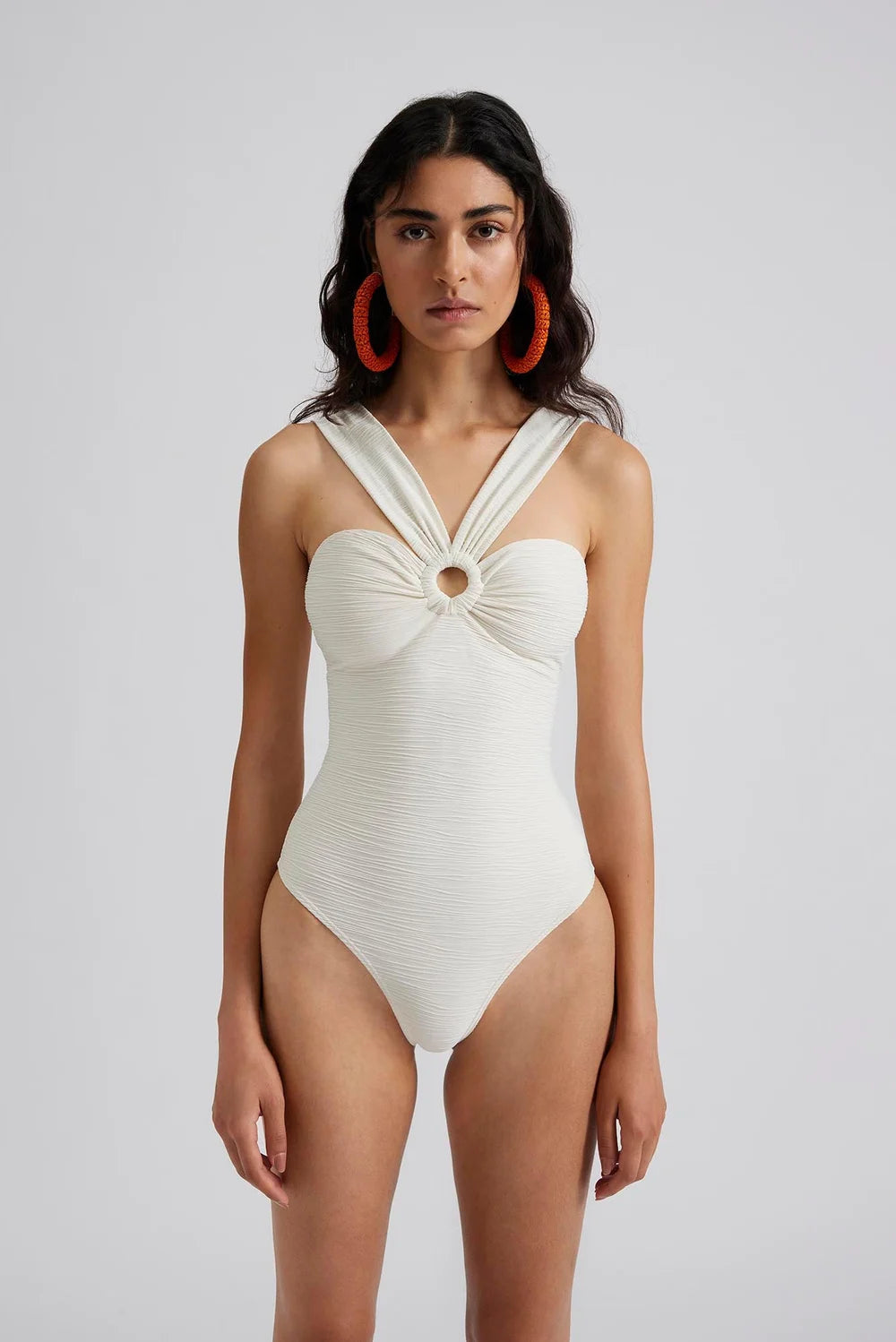 Ecru textured swimming costume with front ring detail and thick V shaped straps 