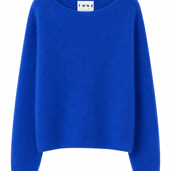 A bright royal blue knit sweater with a wide boat neckline and long sleeves, shown against a plain white background. The brand label 'T W N S' is visible inside the collar.