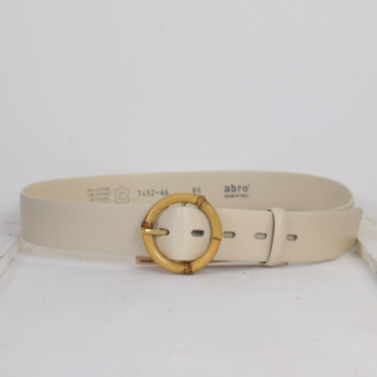 Cream belt with circular buckle