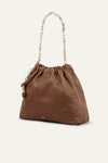 Brown leather handbag with a drawstring top on a white background from bash