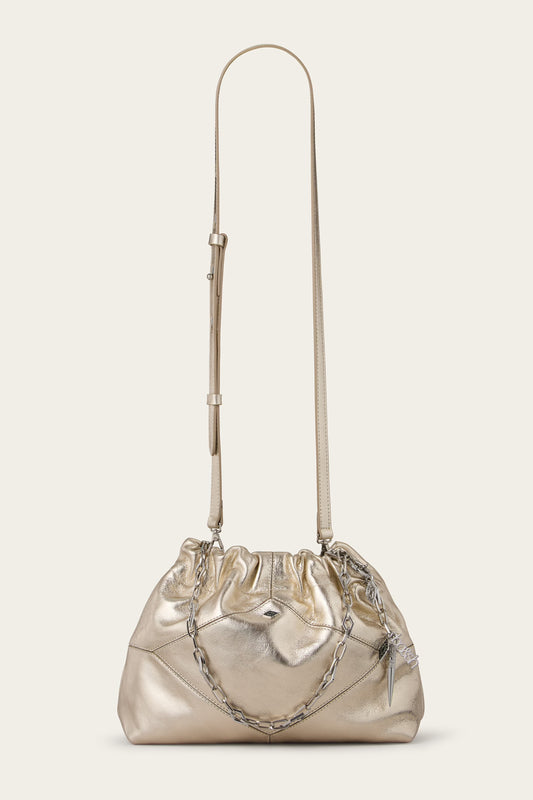 Metallic handbag with a chain detail on a beige background from Ba&sh