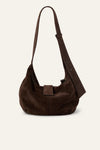 Brown suede handbag on a light beige background