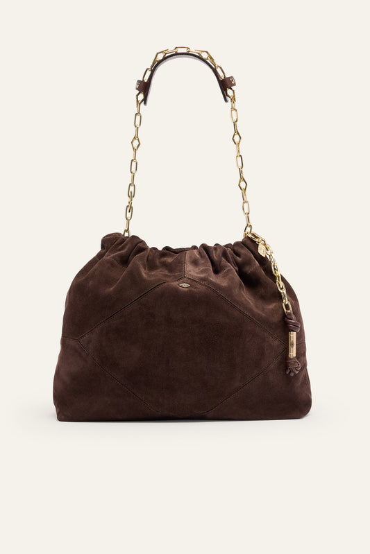 Brown suede handbag with gold chain handle on a white background