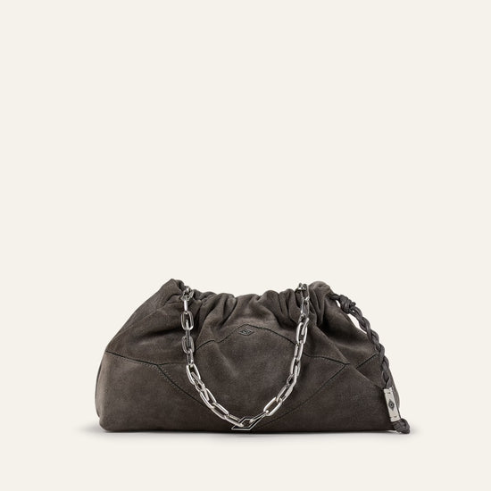 Dark gray clutch bag with chain detail on a beige background from ba&sh