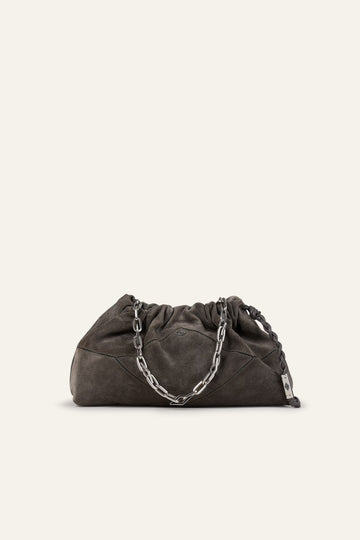 Dark gray clutch bag with chain detail on a beige background from ba&sh