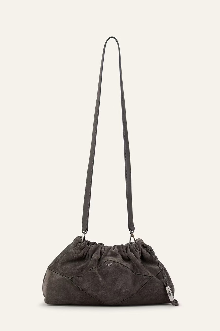 Dark gray shoulder bag with a long strap on a light beige background from ba&sh
