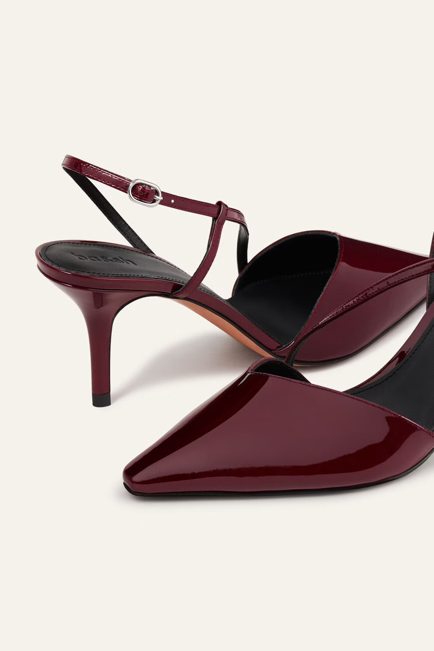 Maroon high-heeled shoes with a slingback design on a white background