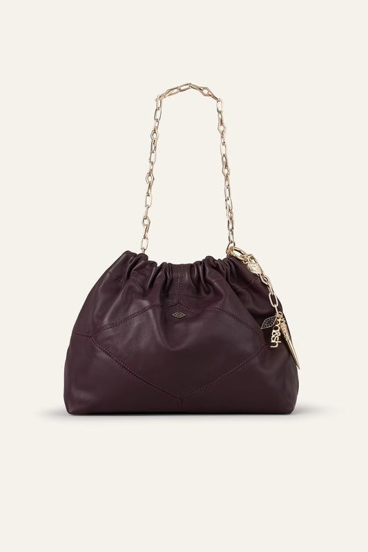 small burgundy leather scrunched bucket with gold chain strap and bag charm from ba&sh