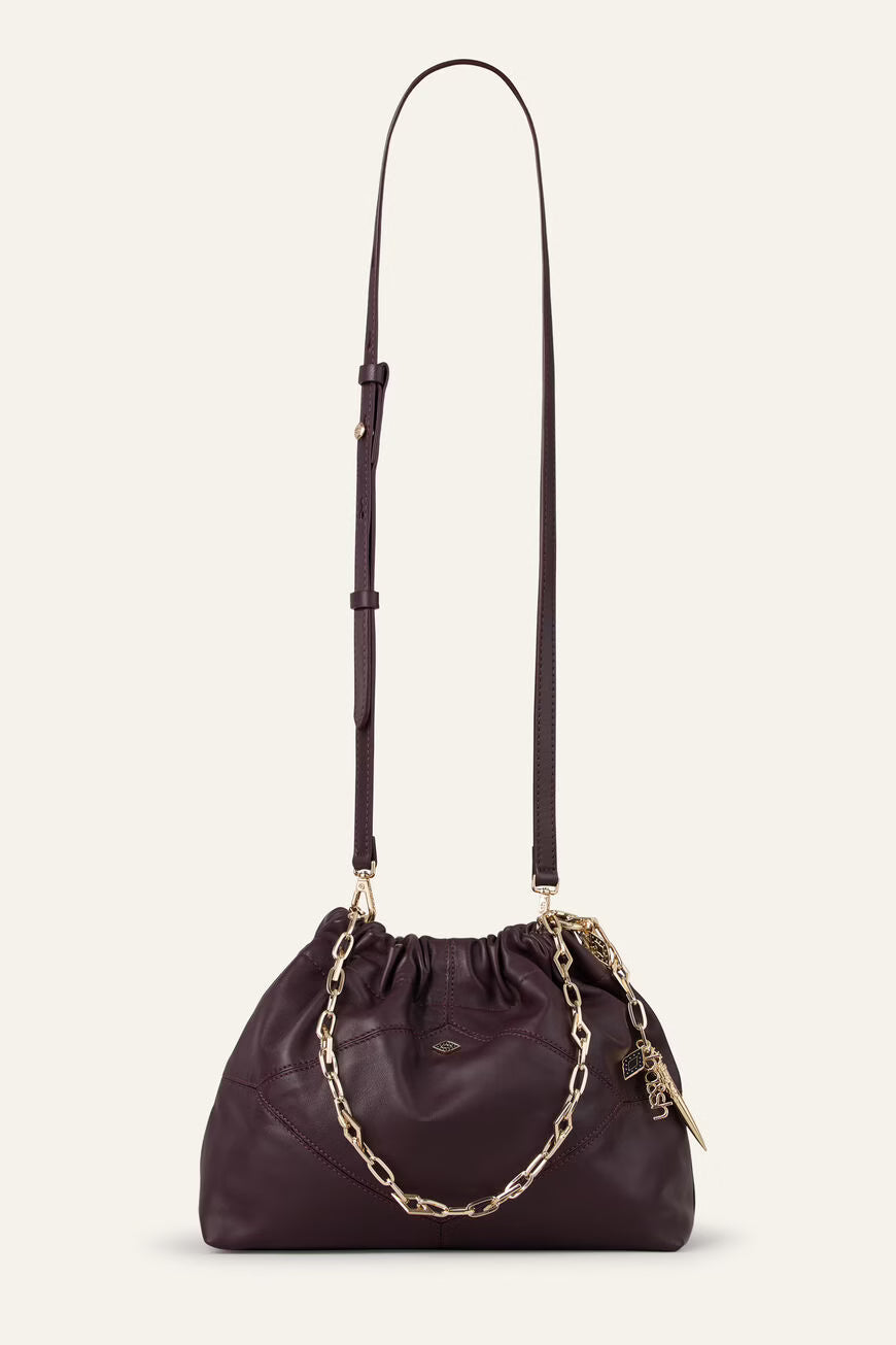 small burgundy leather scrunched bucket with gold chain strap and bag charm from ba&sh with longer cross body strap attached