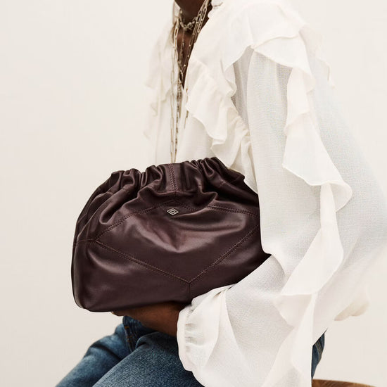 small burgundy leather scrunched bucket with gold chain strap and bag charm from ba&sh model shot