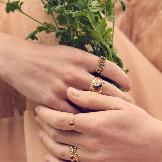 heart shaped spiky ring with red stone and adjustable band from rachel jackson model shot