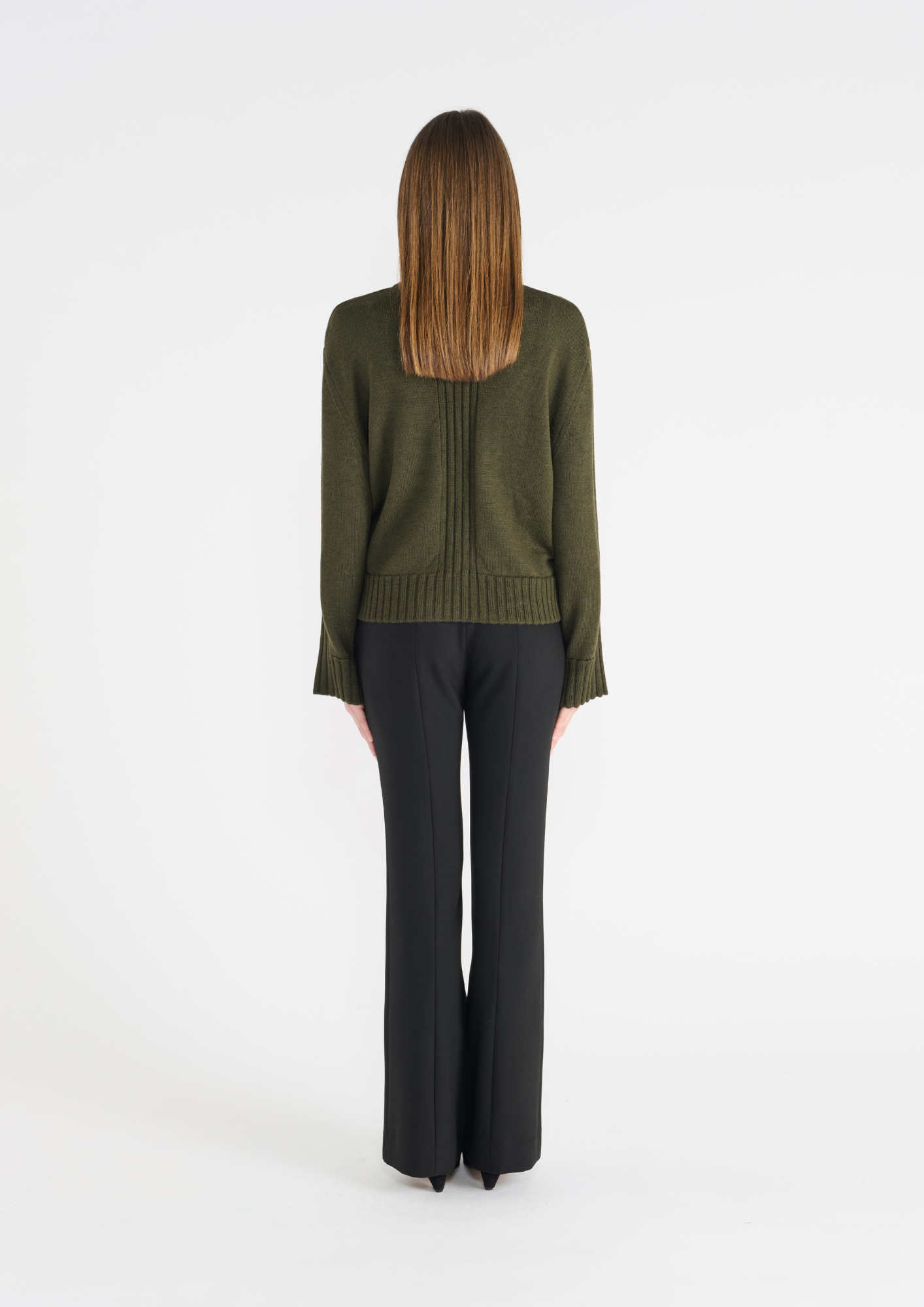 Dark green jumper with round neck, and ribbed hem and cuffs. Rear view