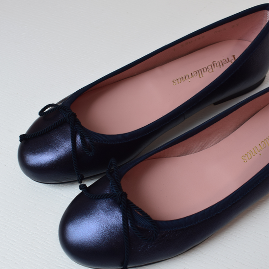 Shimmer navy blue classic round toe ballet pumps with navy thin ribbed binding and navy thin rope bow on toe