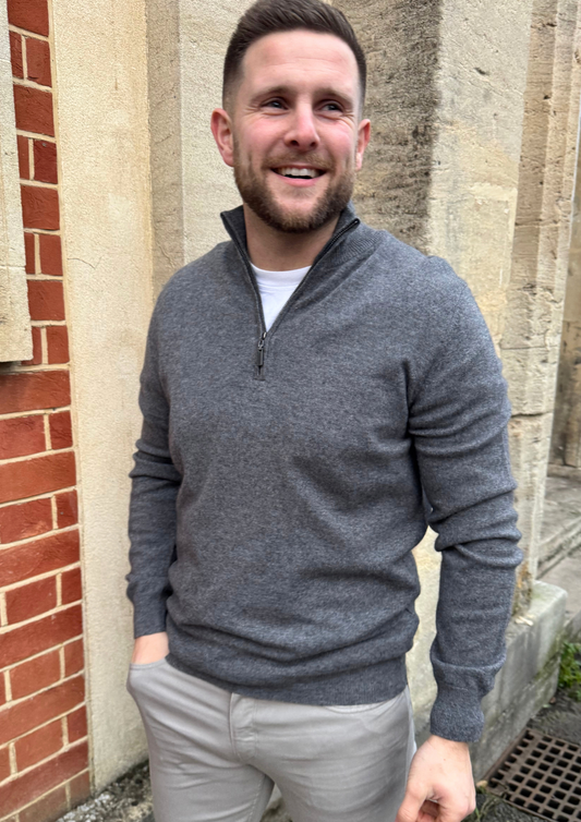 Male model wearing grey cashmere quarter zip jumper.