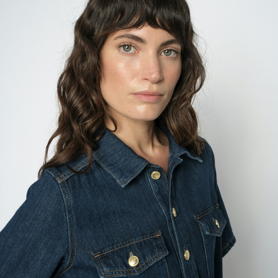 woman wearing denim dress close up
