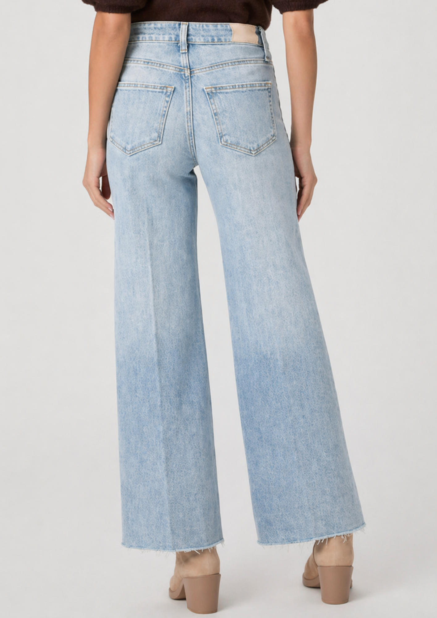 blue jeans on model on plain background
