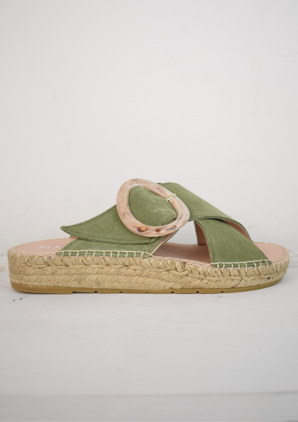 Pale green slider with buckle detail and raffia sole 