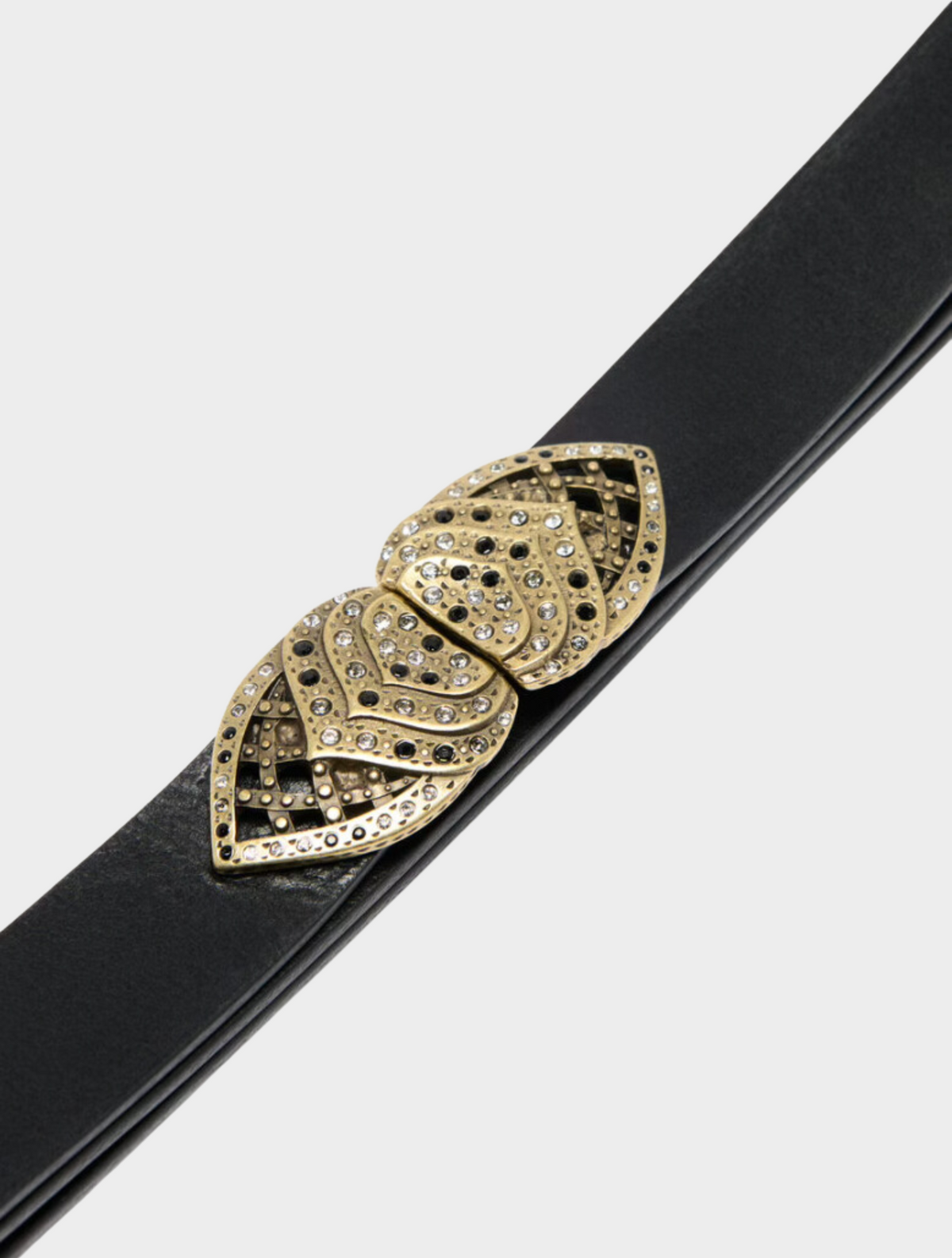Black leather belt adjustable at the back with a gold metallic buckle that clips at the front with small crystals