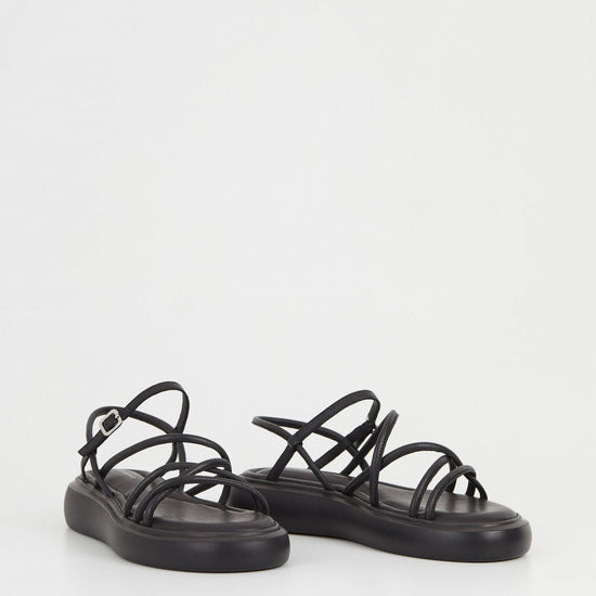 Black strappy chunky sole leather sandals