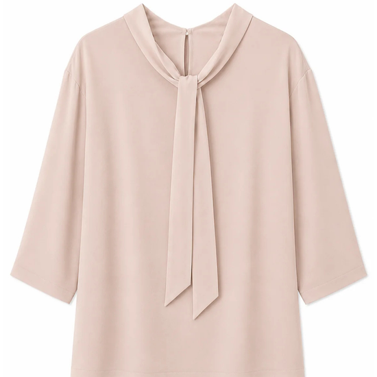 reverse flat lay of a blush pink blouse with a tie neck detail