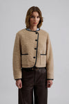 wool cropped jacket with black trim and leather buttons  model shot