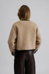 wool cropped jacket with black trim and leather buttons  rear view 