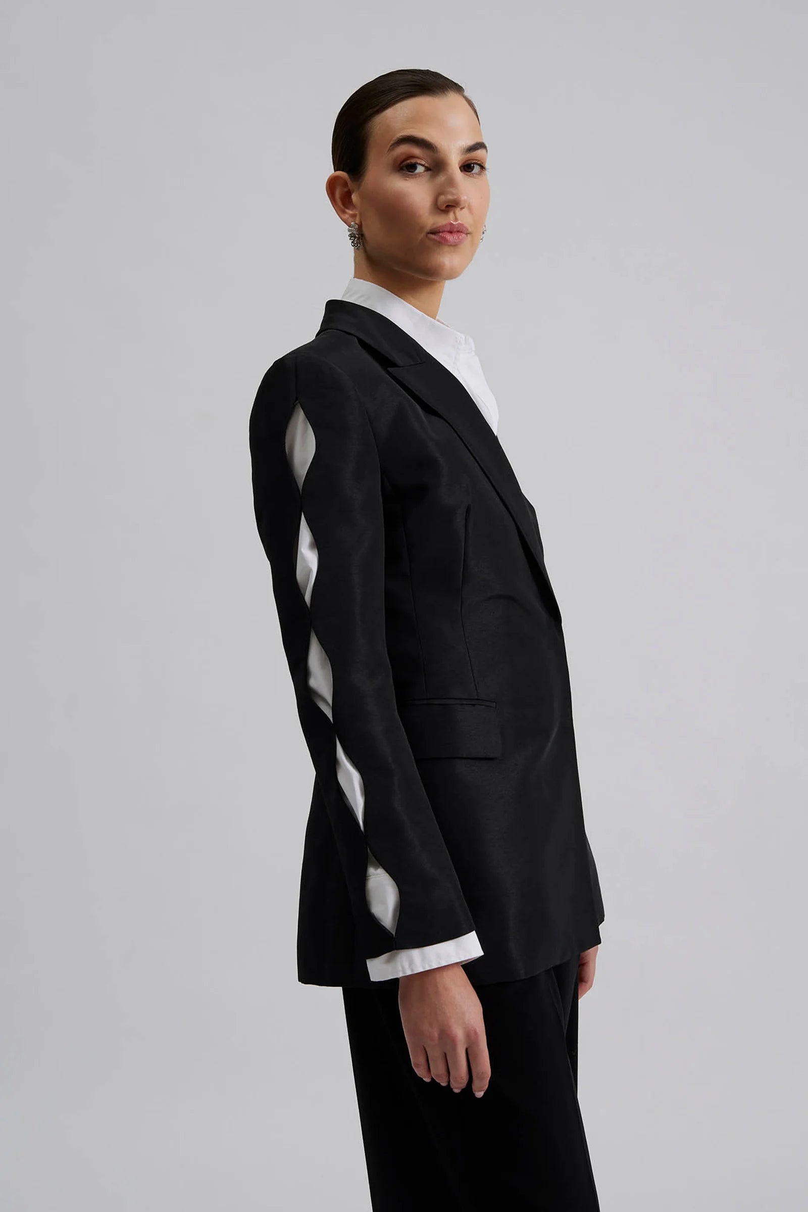 black blazer with cut out detail on sleeves side view 