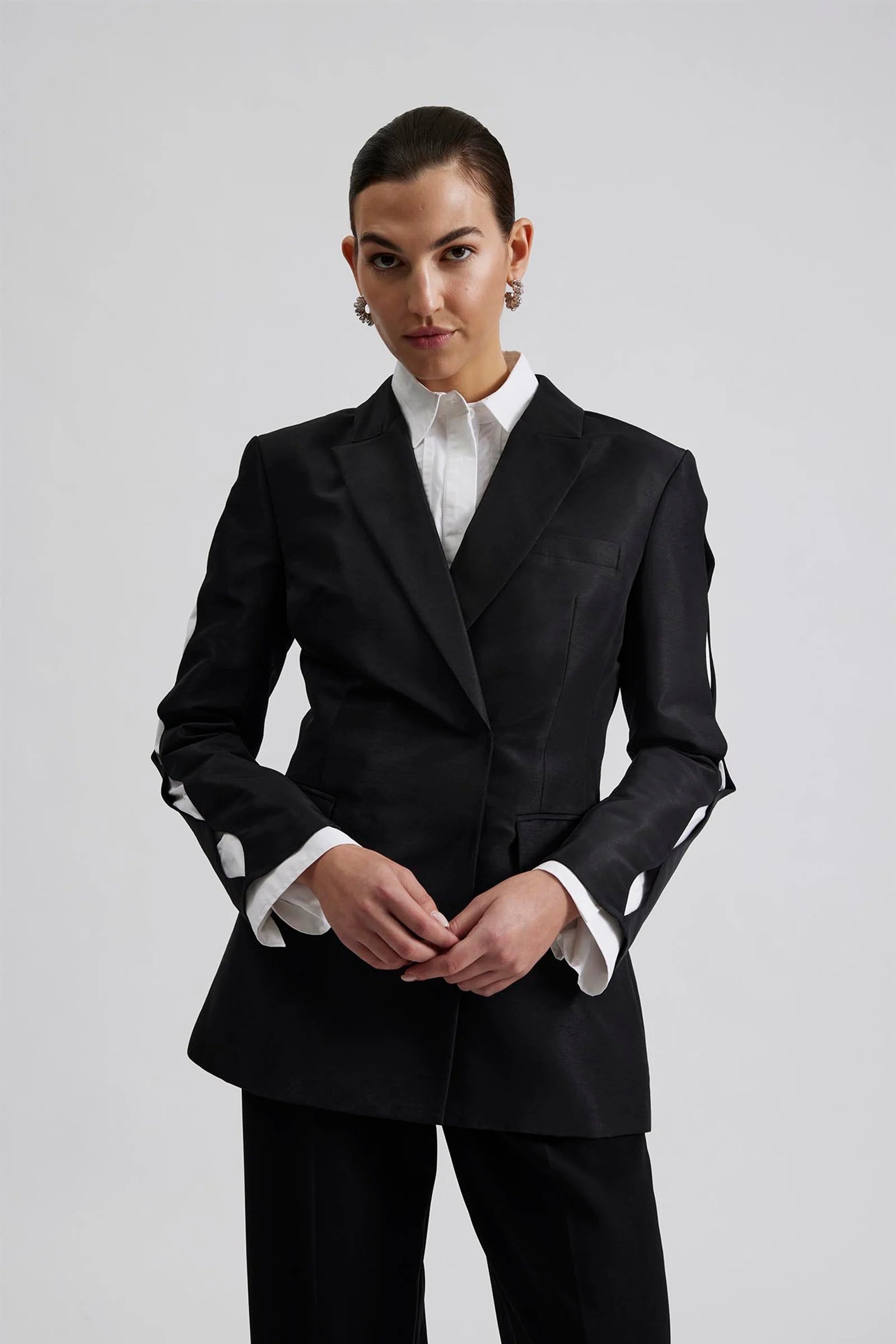 black blazer with cut out detail on sleeves