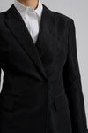 black blazer with cut out detail on sleeves close up