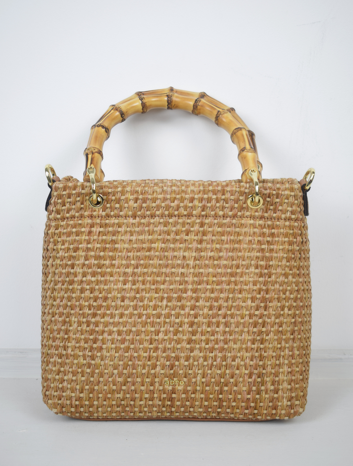 raffia bag with bamboo handle and longer nude cross body strap