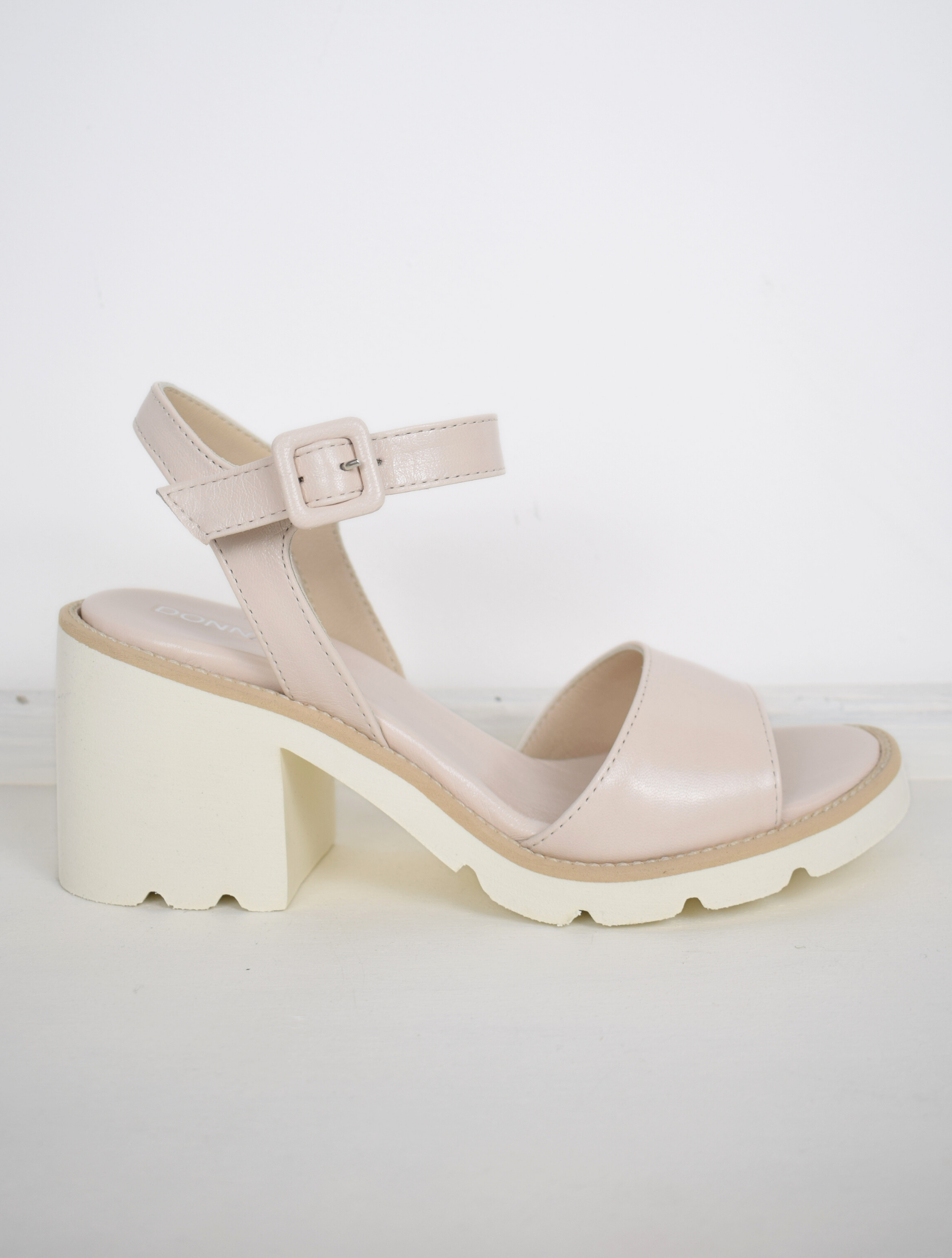nude sandals with a white block heel 
