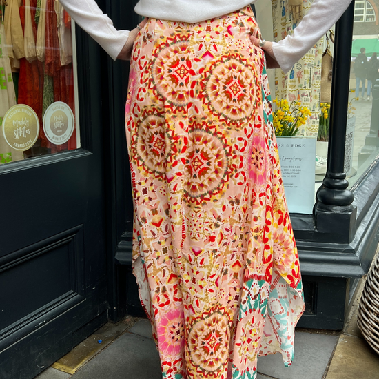 Pink tiedye skirt Patterned maxi skirt in tones of pink and turquoise with a shaped hem detail