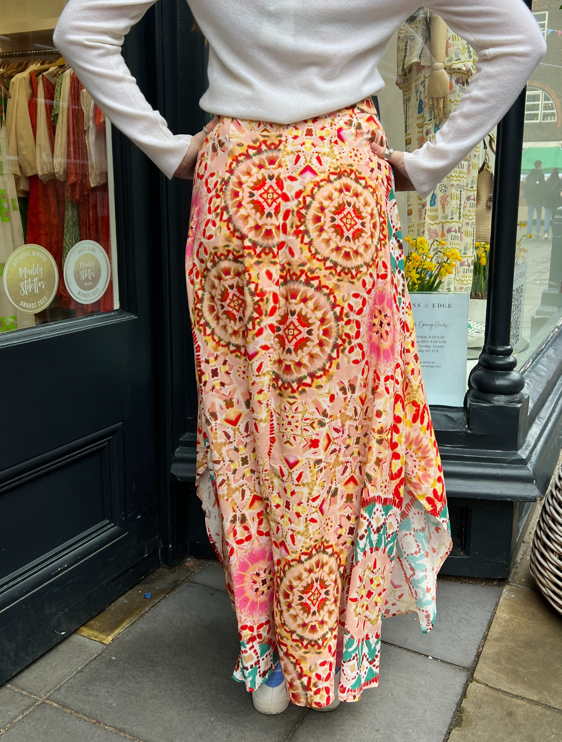 Pink tiedye skirt Patterned maxi skirt in tones of pink and turquoise with a shaped hem detail