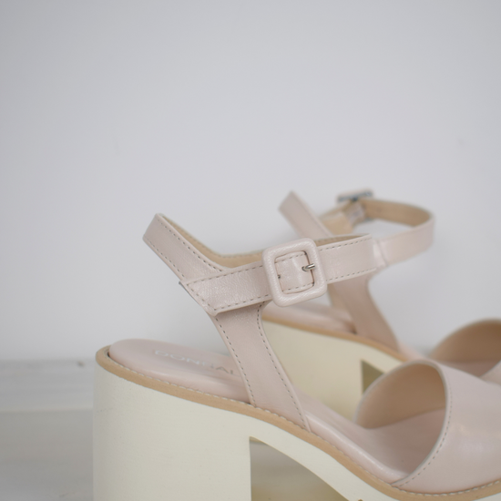 nude sandals with a white block heel 