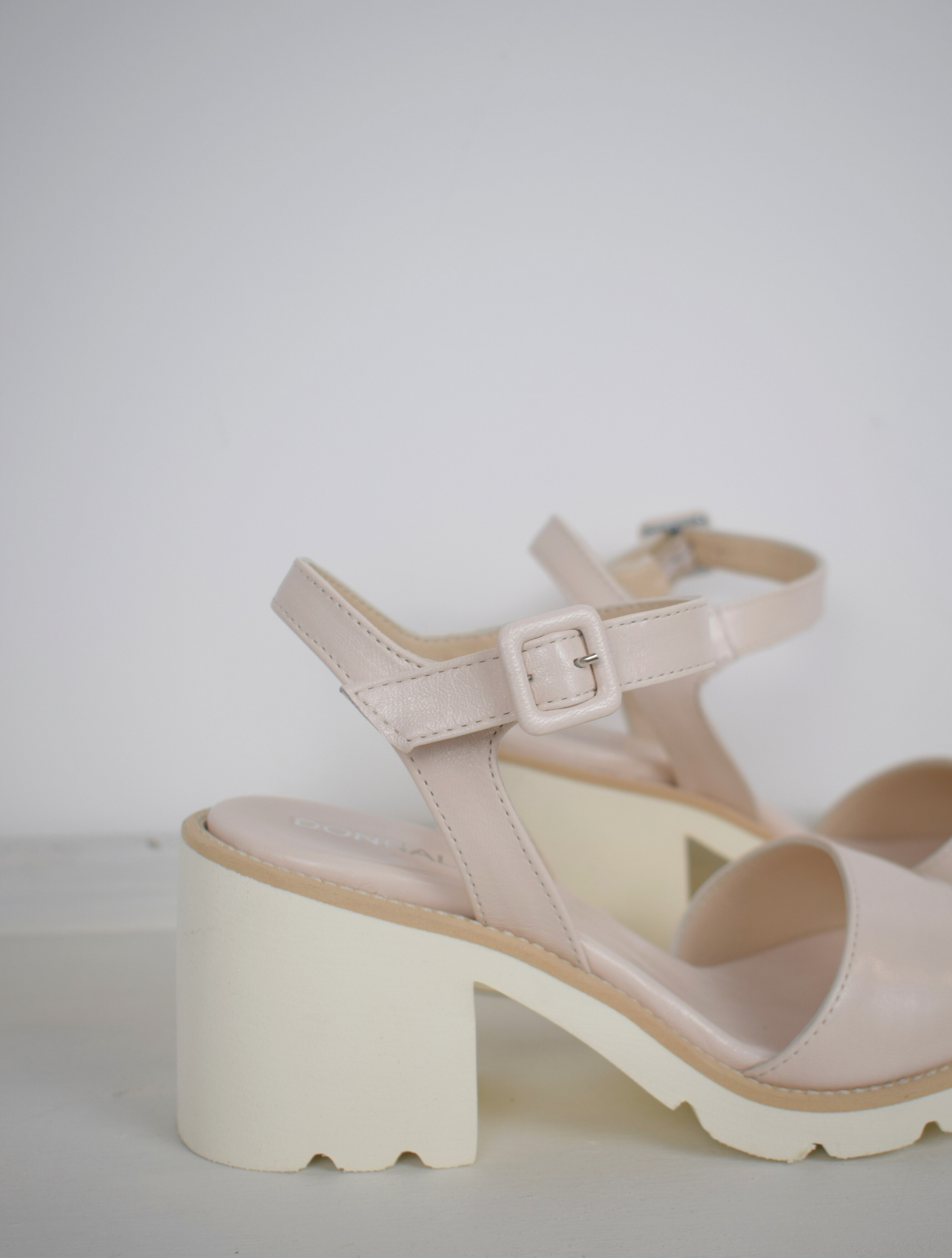 nude sandals with a white block heel 