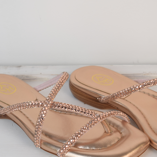 Slider style sandal in a rose gold colour with dominates on the top