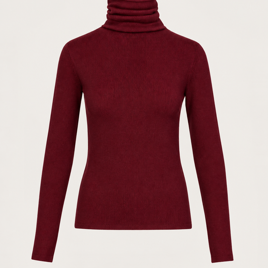 A dark burgundy ribbed knit turtleneck sweater displayed on a ghost mannequin against a light off-white background.