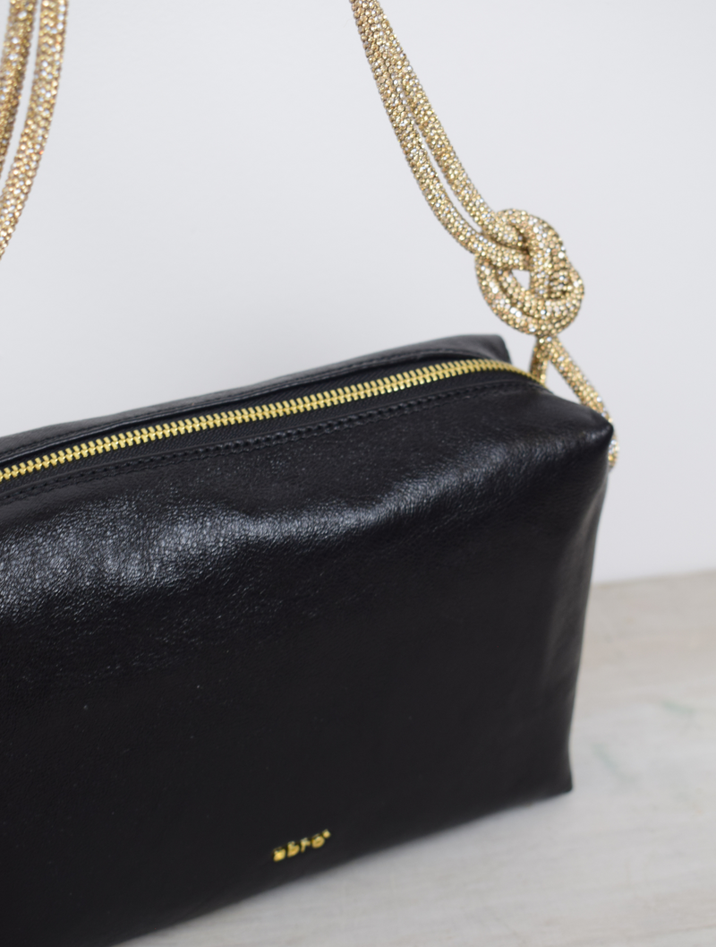 Black bag with gold rope handle