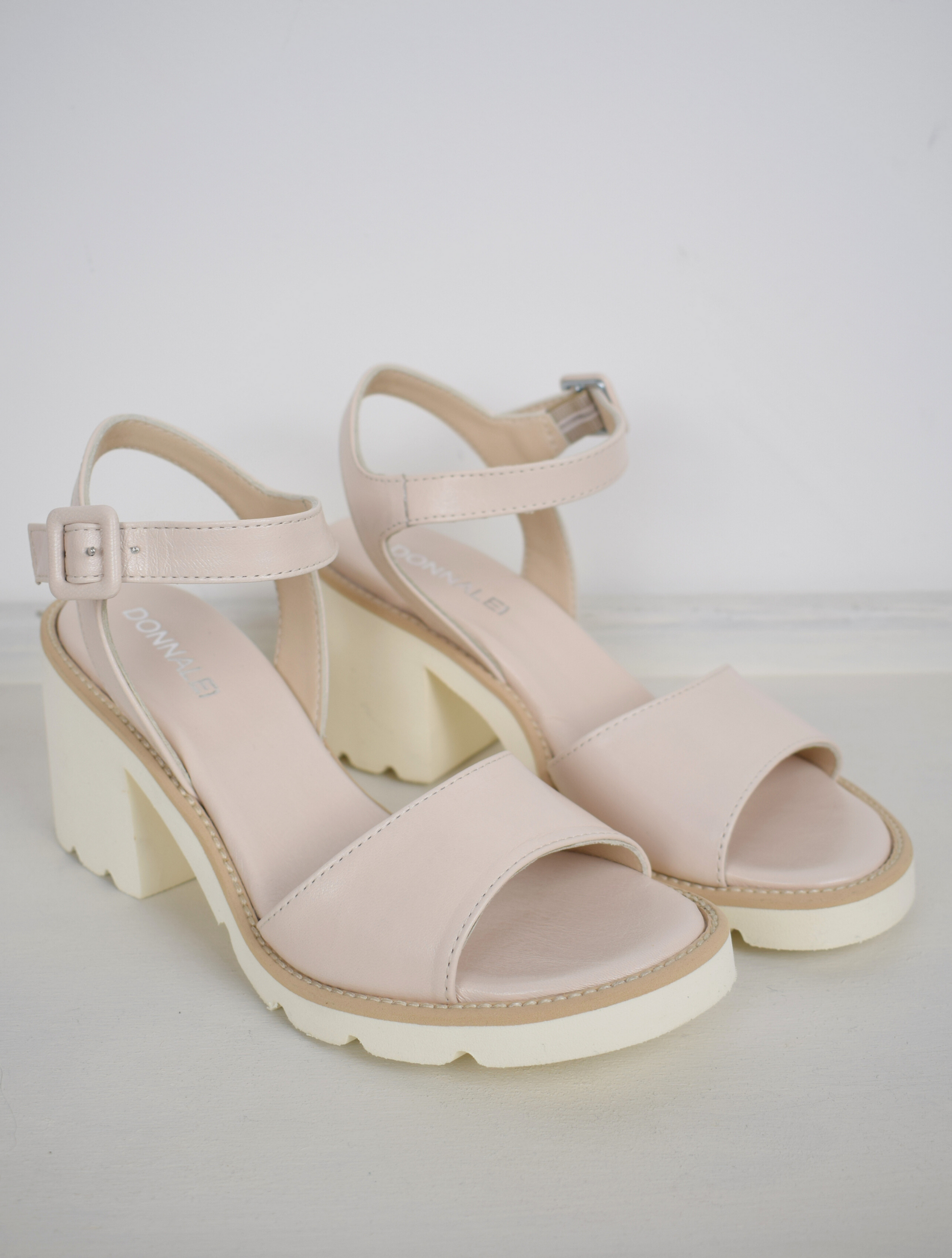 nude sandals with a white block heel 