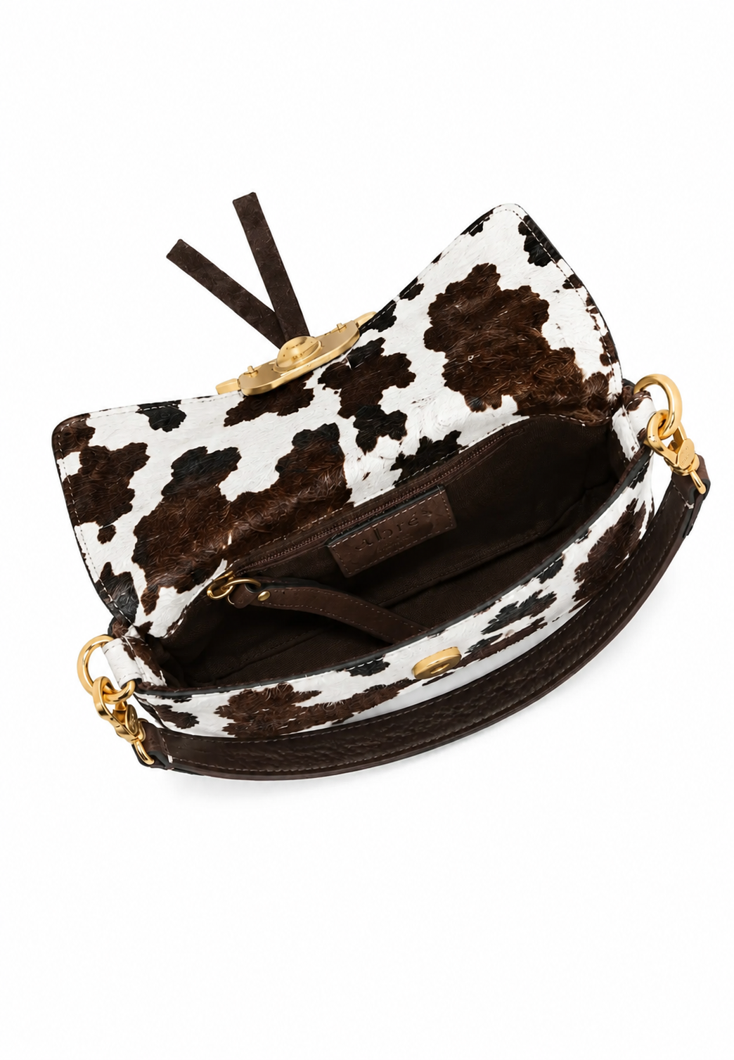 A cow-print clutch handbag with brown faux-leather trim, gold-tone hardware, and a dark brown interior, shown from an overhead angle on a white background.